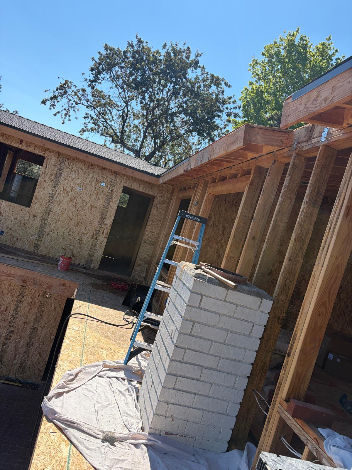 Interior brick chimney masonry at the fireplace base